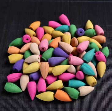 Colorful wooden beads on a dark surface