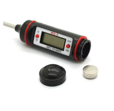 Digital thermometer with probe and battery on a white background