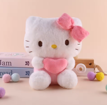 Plush toy resembling a cat with a pink bow and heart on a beige background