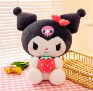 Plush toy with skull design and strawberry on a checkered tablecloth