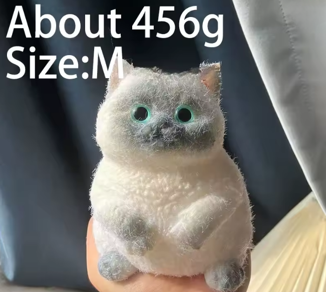 Small plush cat toy held in a hand with text indicating weight and size.
