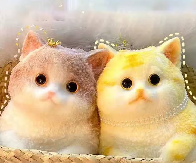 Two fluffy cartoon cats sitting together with a decorative border.