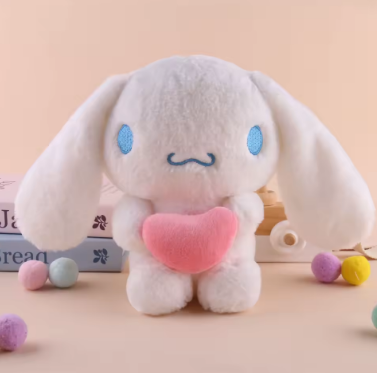 White plush toy with blue eyes and a pink heart on a beige background